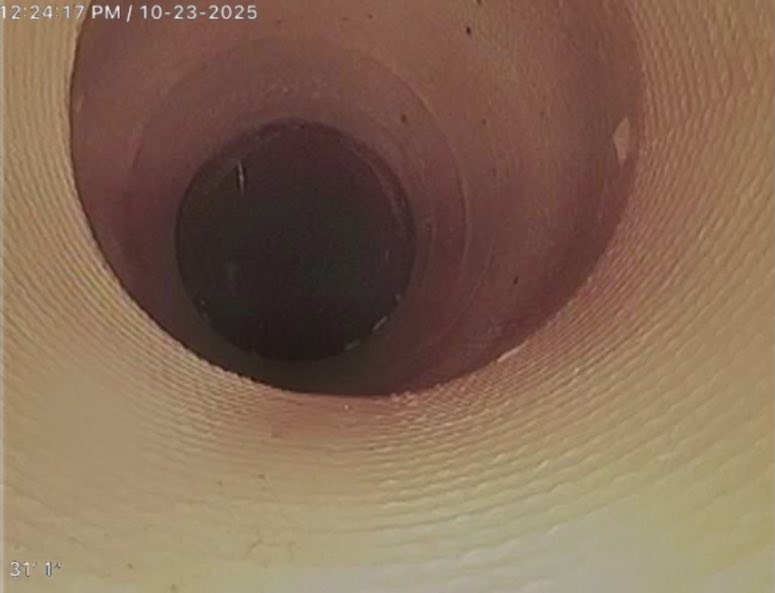Sewer camera and monitor used to inspect an underground sewer line