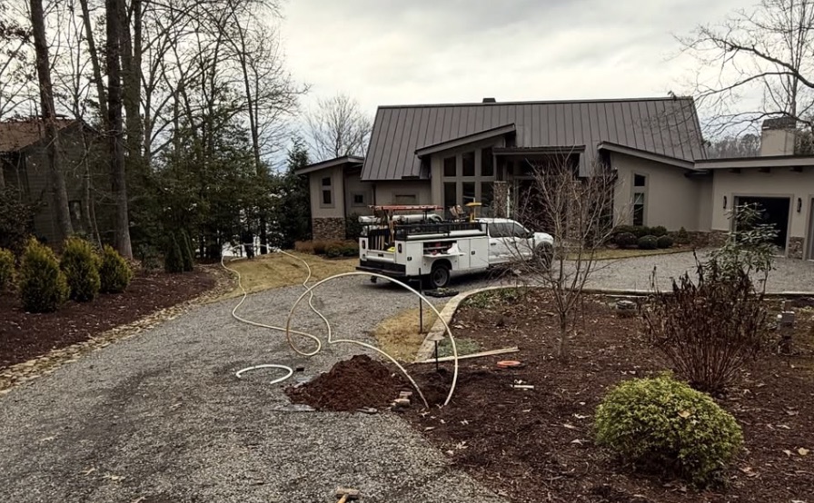 Specialty Plumbing crew locating or accessing an underground sewer line